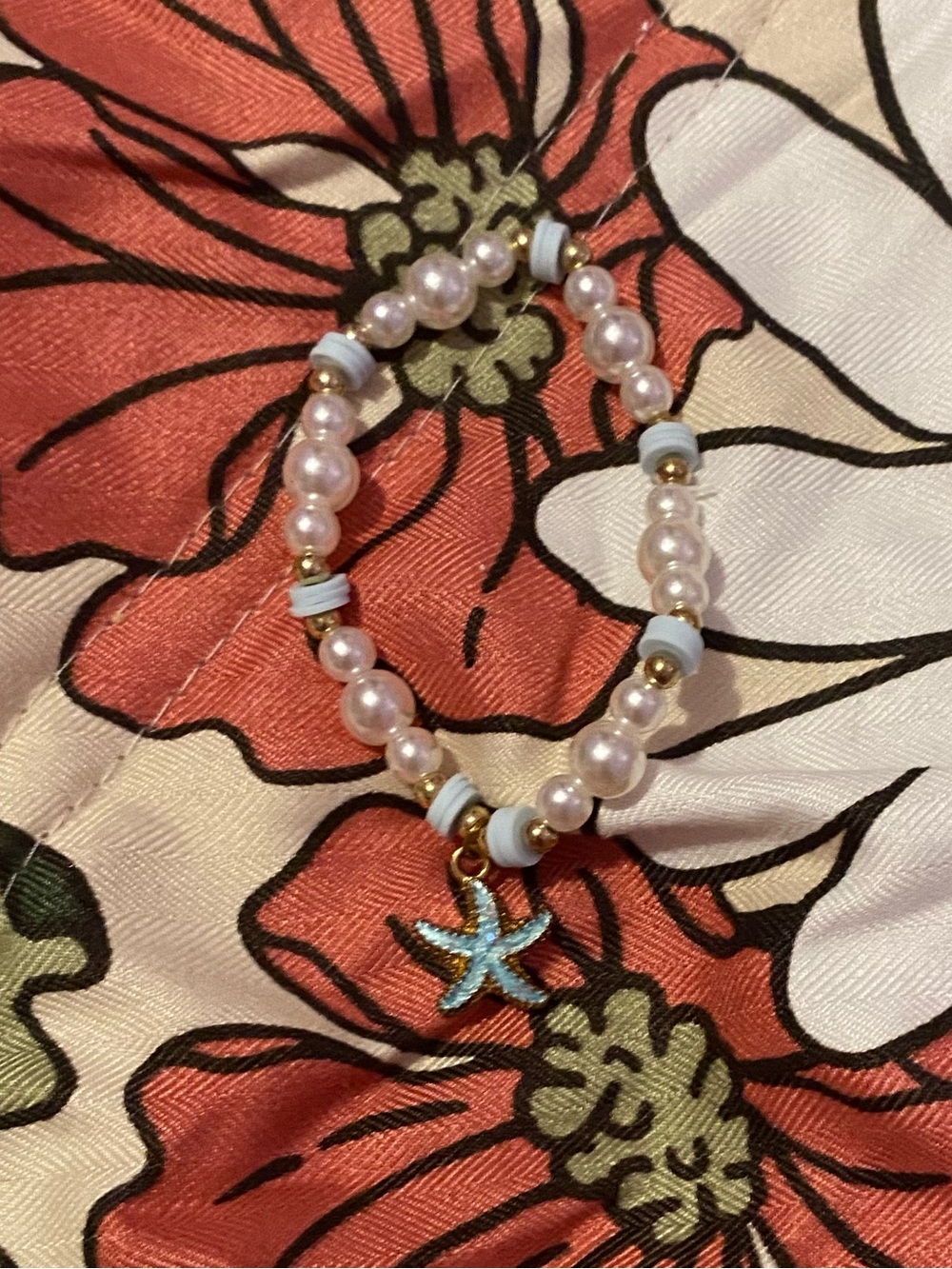Beach themed beaded bracelet with pearls and light blue clay beads
